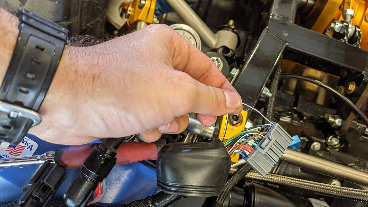 Clutch switch mounted on the clutch tube, spring wrapped around the barrel in the clutch arm